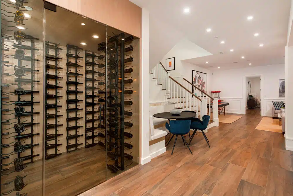 Wine cellar installation featuring custom millwork and lighting